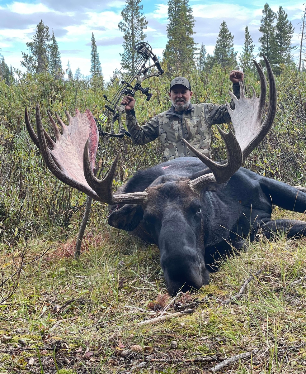 Richard Robinson from Ivory and Antler Outfitters with a trophy Shiras moose hunted in Colorado